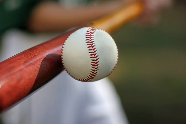 a baseball player hitting a ball