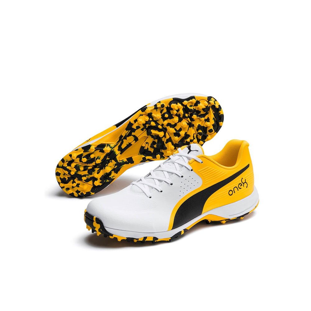 puma cricket shoe with white background